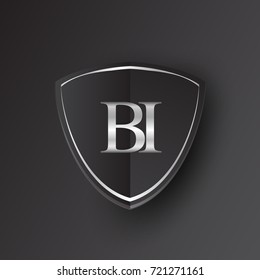 Initial logo letter BI with shield Icon silver color isolated on black background, logotype design for company identity.