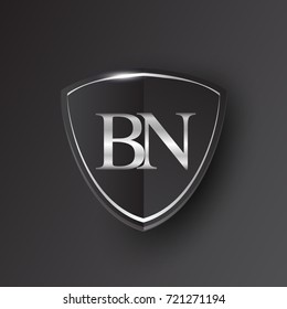 Initial logo letter BN with shield Icon silver color isolated on black background, logotype design for company identity.
