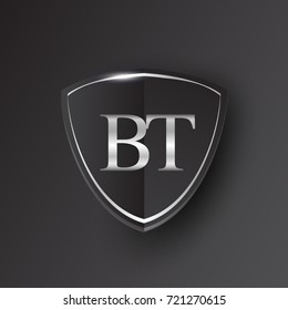 Initial logo letter BT with shield Icon silver color isolated on black background, logotype design for company identity.