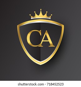 Initial logo letter CA with shield and crown Icon golden color isolated on black background, logotype design for company identity.