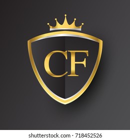 Initial logo letter CF with shield and crown Icon golden color isolated on black background, logotype design for company identity.