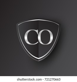 Initial logo letter CO with shield Icon silver color isolated on black background, logotype design for company identity.
