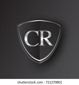 Initial logo letter CR with shield Icon silver color isolated on black background, logotype design for company identity.