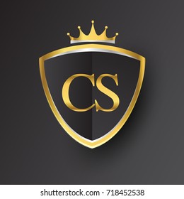 Initial logo letter CS with shield and crown Icon golden color isolated on black background, logotype design for company identity.