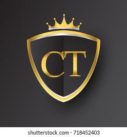 Initial logo letter CT with shield and crown Icon golden color isolated on black background, logotype design for company identity.