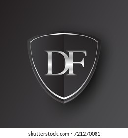 Initial logo letter DF with shield Icon silver color isolated on black background, logotype design for company identity.