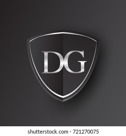 Initial logo letter DG with shield Icon silver color isolated on black background, logotype design for company identity.