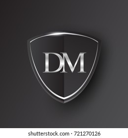 Initial logo letter DM with shield Icon silver color isolated on black background, logotype design for company identity.