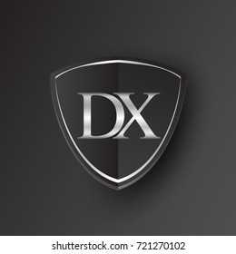 Initial logo letter DX with shield Icon silver color isolated on black background, logotype design for company identity.