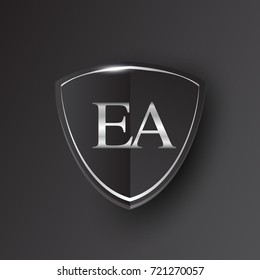 Initial logo letter EA with shield Icon silver color isolated on black background, logotype design for company identity.