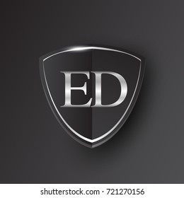 Initial logo letter ED with shield Icon silver color isolated on black background, logotype design for company identity.