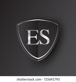 Initial logo letter ES with shield Icon silver color isolated on black background, logotype design for company identity.