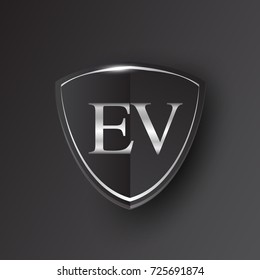 Initial logo letter EV with shield Icon silver color isolated on black background, logotype design for company identity.