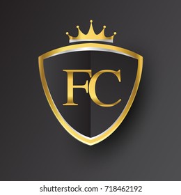 Initial logo letter FC with shield and crown Icon golden color isolated on black background, logotype design for company identity.