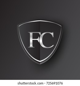 Initial logo letter FC with shield Icon silver color isolated on black background, logotype design for company identity.