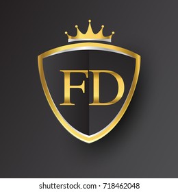 Initial logo letter FD with shield and crown Icon golden color isolated on black background, logotype design for company identity.