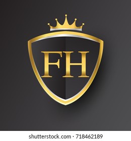 Initial logo letter FH with shield and crown Icon golden color isolated on black background, logotype design for company identity.