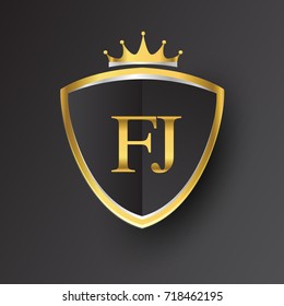 Initial logo letter FJ with shield and crown Icon golden color isolated on black background, logotype design for company identity