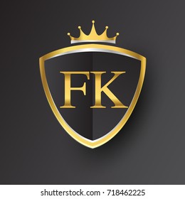 Initial logo letter FK with shield and crown Icon golden color isolated on black background, logotype design for company identity.