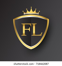 Initial logo letter FL with shield and crown Icon golden color isolated on black background, logotype design for company identity.