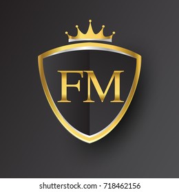 Initial logo letter FM with shield and crown Icon golden color isolated on black background, logotype design for company identity.