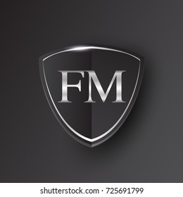 Initial logo letter FM with shield Icon silver color isolated on black background, logotype design for company identity.