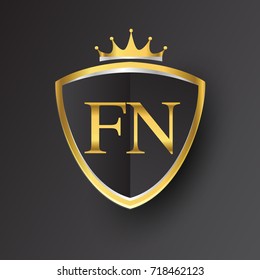 Initial logo letter FN with shield and crown Icon golden color isolated on black background, logotype design for company identity.