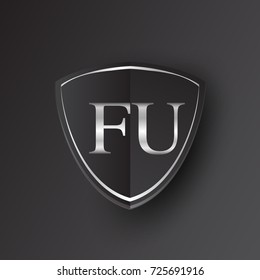 Initial logo letter FU with shield Icon silver color isolated on black background, logotype design for company identity.