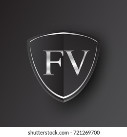 Initial logo letter FV with shield Icon silver color isolated on black background, logotype design for company identity.