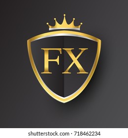 Initial logo letter FX with shield and crown Icon golden color isolated on black background, logotype design for company identity.