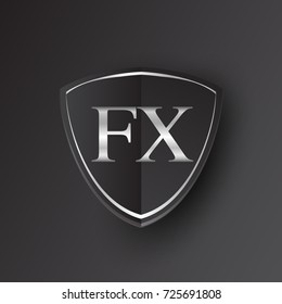 Initial logo letter FX with shield Icon silver color isolated on black background, logotype design for company identity.