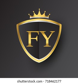 Initial logo letter FY with shield and crown Icon golden color isolated on black background, logotype design for company identity.