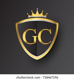 Initial logo letter GC with shield and crown Icon golden color isolated on black background, logotype design for company identity.