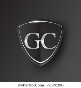 Initial logo letter GC with shield Icon silver color isolated on black background, logotype design for company identity.