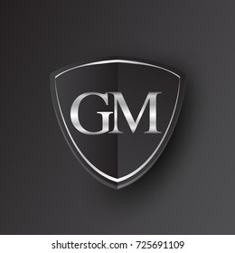 Initial logo letter GM with shield Icon silver color isolated on black background, logotype design for company identity.