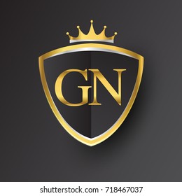 Initial logo letter GN with shield and crown Icon golden color isolated on black background, logotype design for company identity.