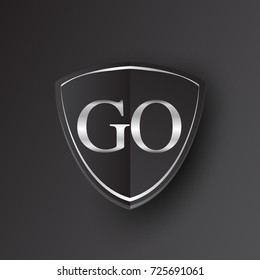 Initial logo letter GO with shield Icon silver color isolated on black background, logotype design for company identity.