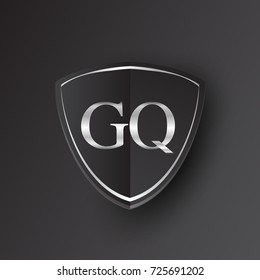 Initial logo letter GQ with shield Icon silver color isolated on black background, logotype design for company identity.