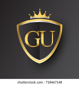 Initial logo letter GU with shield and crown Icon golden color isolated on black background, logotype design for company identity.