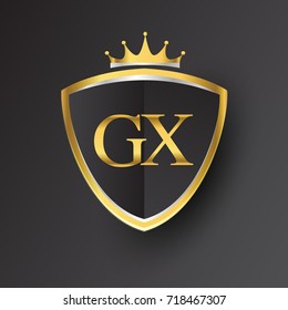 Initial logo letter GX with shield and crown Icon golden color isolated on black background, logotype design for company identity.