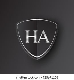 Initial logo letter HA with shield Icon silver color isolated on black background, logotype design for company identity.
