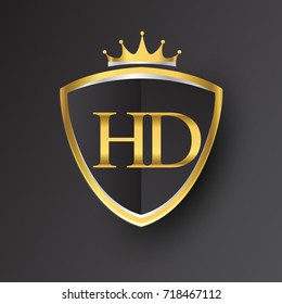 Initial logo letter HD with shield and crown Icon golden color isolated on black background, logotype design for company identity.