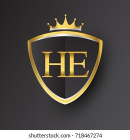 Initial logo letter HE with shield and crown Icon golden color isolated on black background, logotype design for company identity.