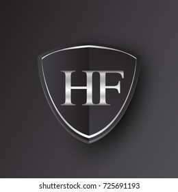 Initial logo letter HF with shield Icon silver color isolated on black background, logotype design for company identity.