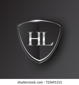 Initial logo letter HL with shield Icon silver color isolated on black background, logotype design for company identity.