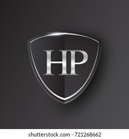 Initial logo letter HP with shield Icon silver color isolated on black background, logotype design for company identity.