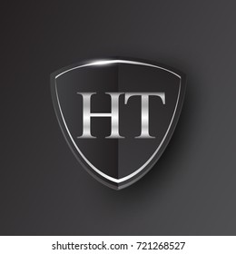 Initial logo letter HT with shield Icon silver color isolated on black background, logotype design for company identity.