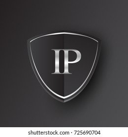 Initial logo letter IP with shield Icon silver color isolated on black background, logotype design for company identity.