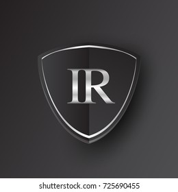 Initial logo letter IR with shield Icon silver color isolated on black background, logotype design for company identity.