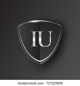 Initial logo letter IU with shield Icon silver color isolated on black background, logotype design for company identity